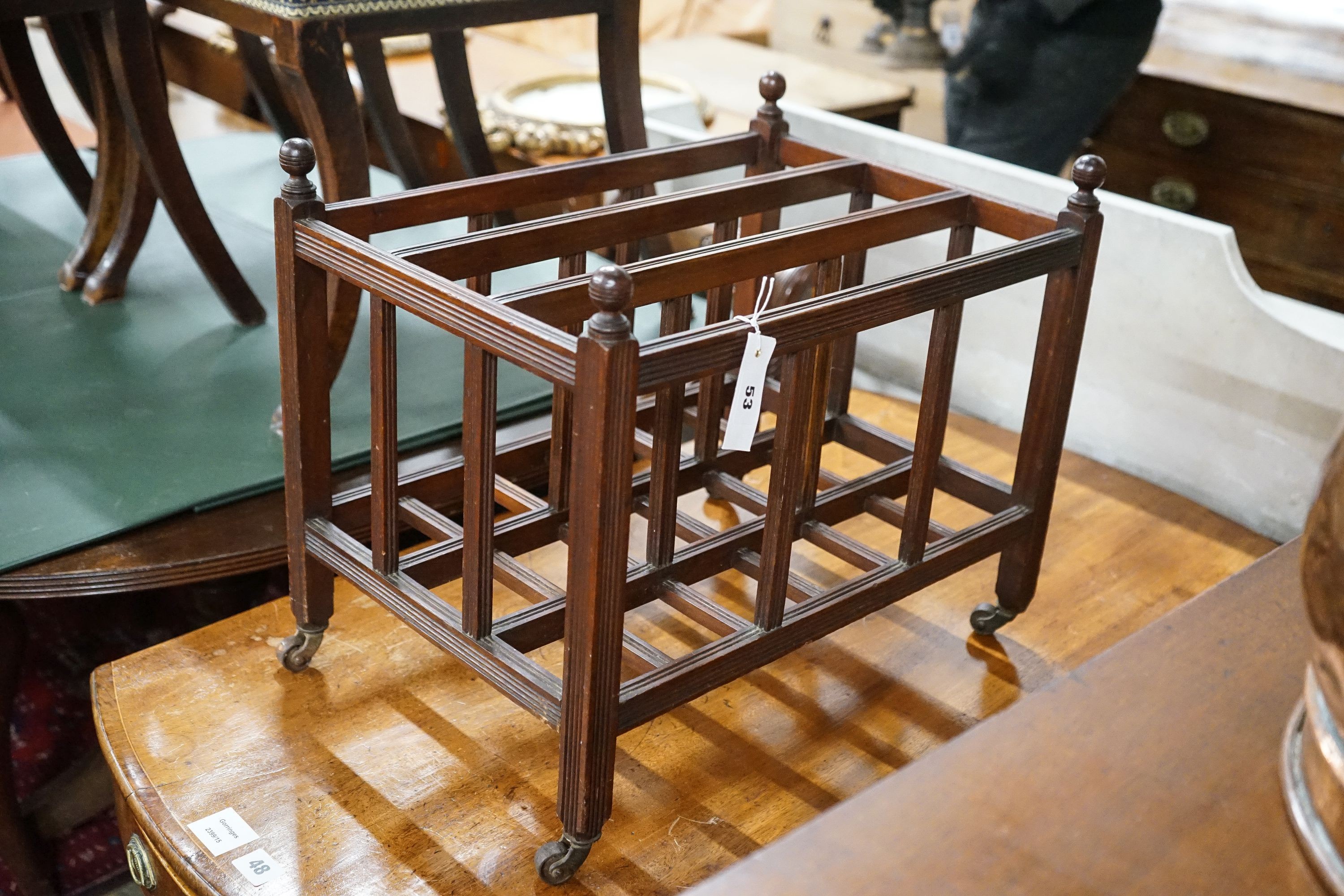 A late Victorian aesthetic movement three division, Canterbury, width 49cm, depth 34cm, height 40cm